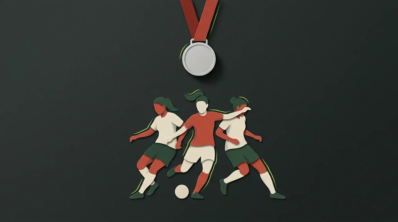 A silver medal and illustrated women’s football team silhouettes.